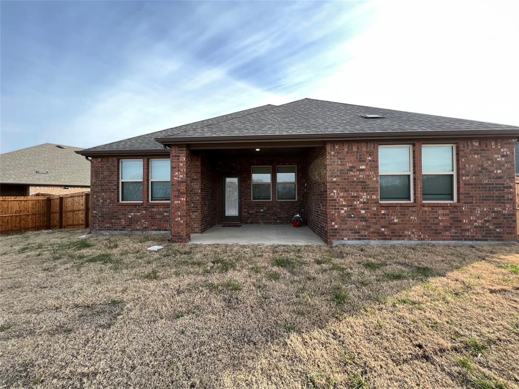 11005 Mustang Trail Aubrey, TX 76227 - Photo 5 of 6 a front view of a house with a yard