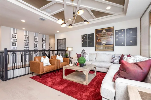 a spacious bedroom with a bed couch and window