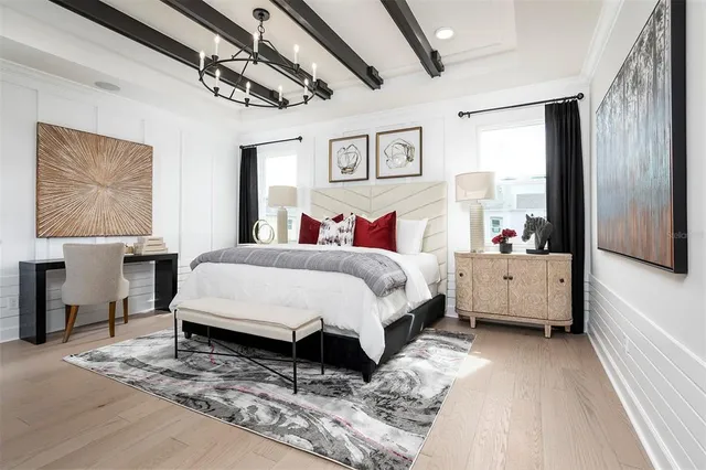 a bathroom with a sink mirror and window