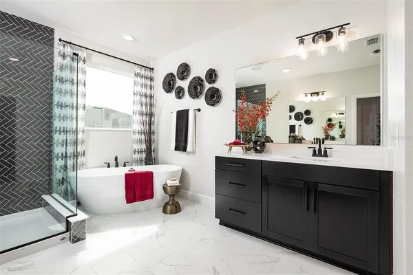 a bathroom with a tub and shower