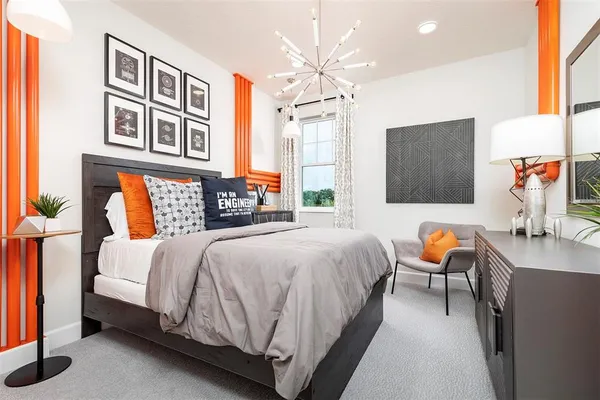 a bathroom with a sink vanity mirror and toilet