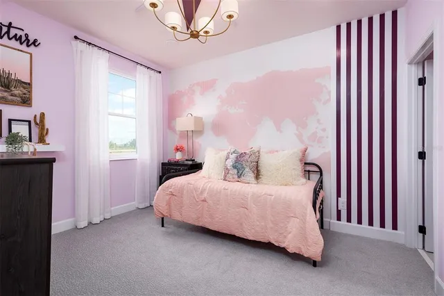 a bedroom with a bed a mirror and a window