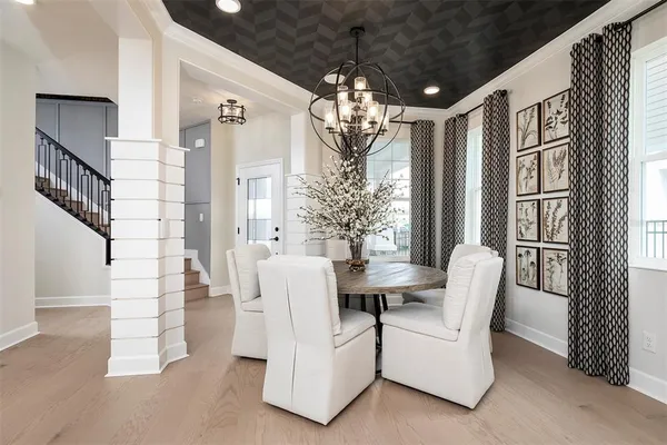 a kitchen with stainless steel appliances kitchen island granite countertop a sink and a refrigerator