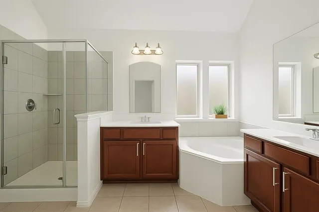a bathroom with a tub a sink and a mirror