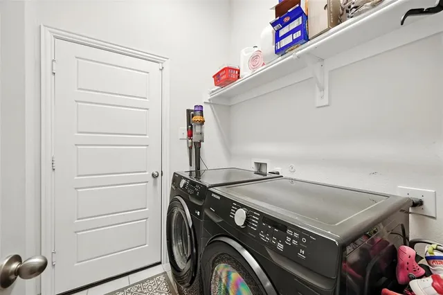a utility room with dryer and washer