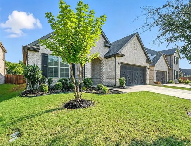 a view of a house with pool and garden
