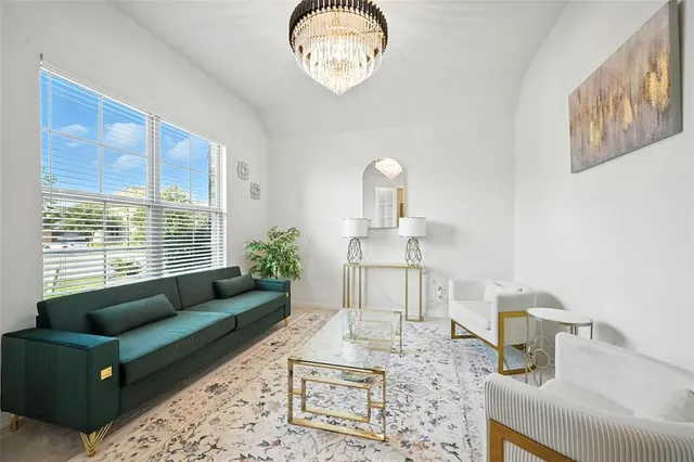 a living room with furniture and a table