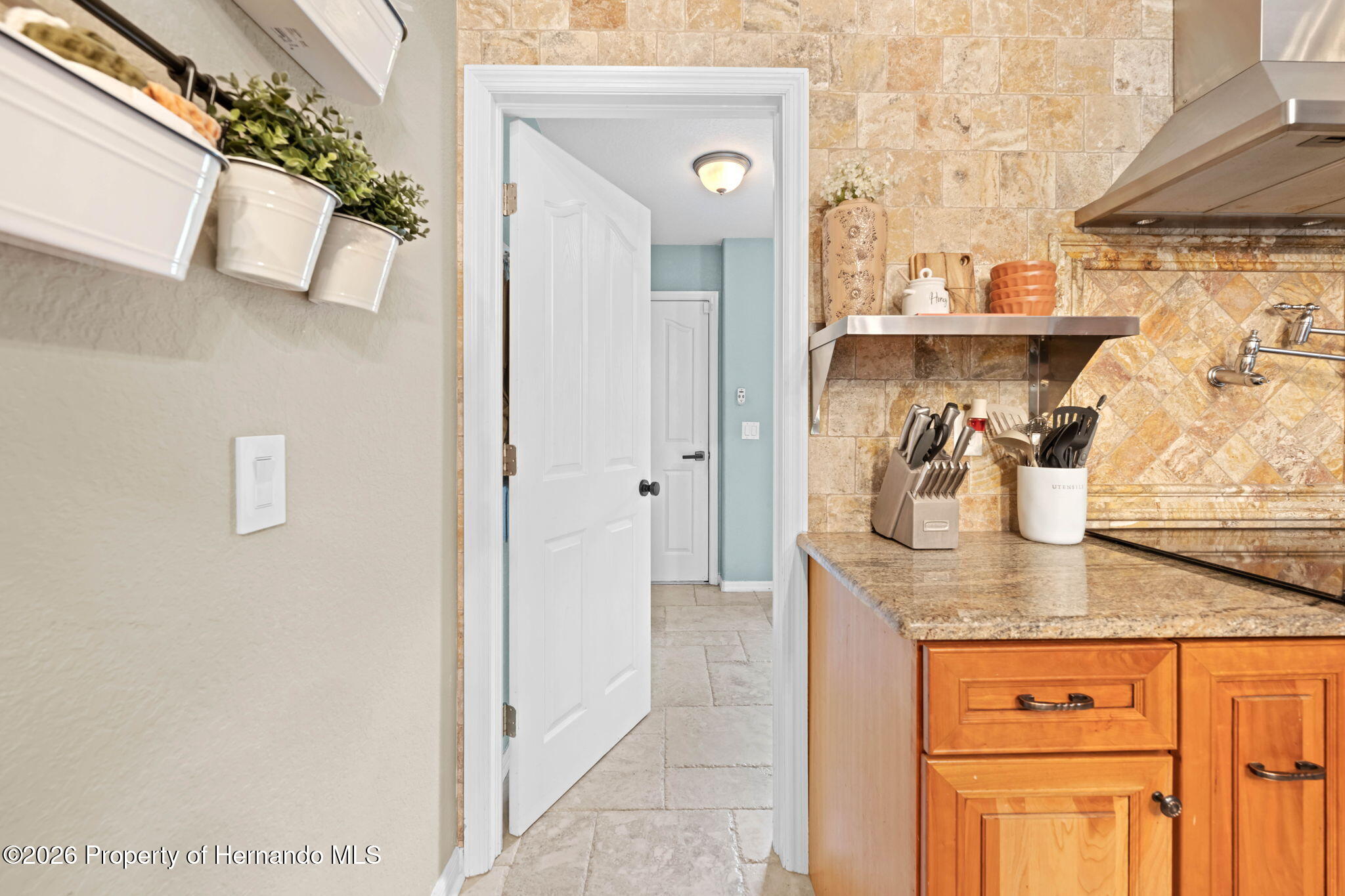 14220 Ermine Owl Road Brooksville, FL 34614 - Photo 22 of 54 a view of bathroom with a sink mirror and vanity