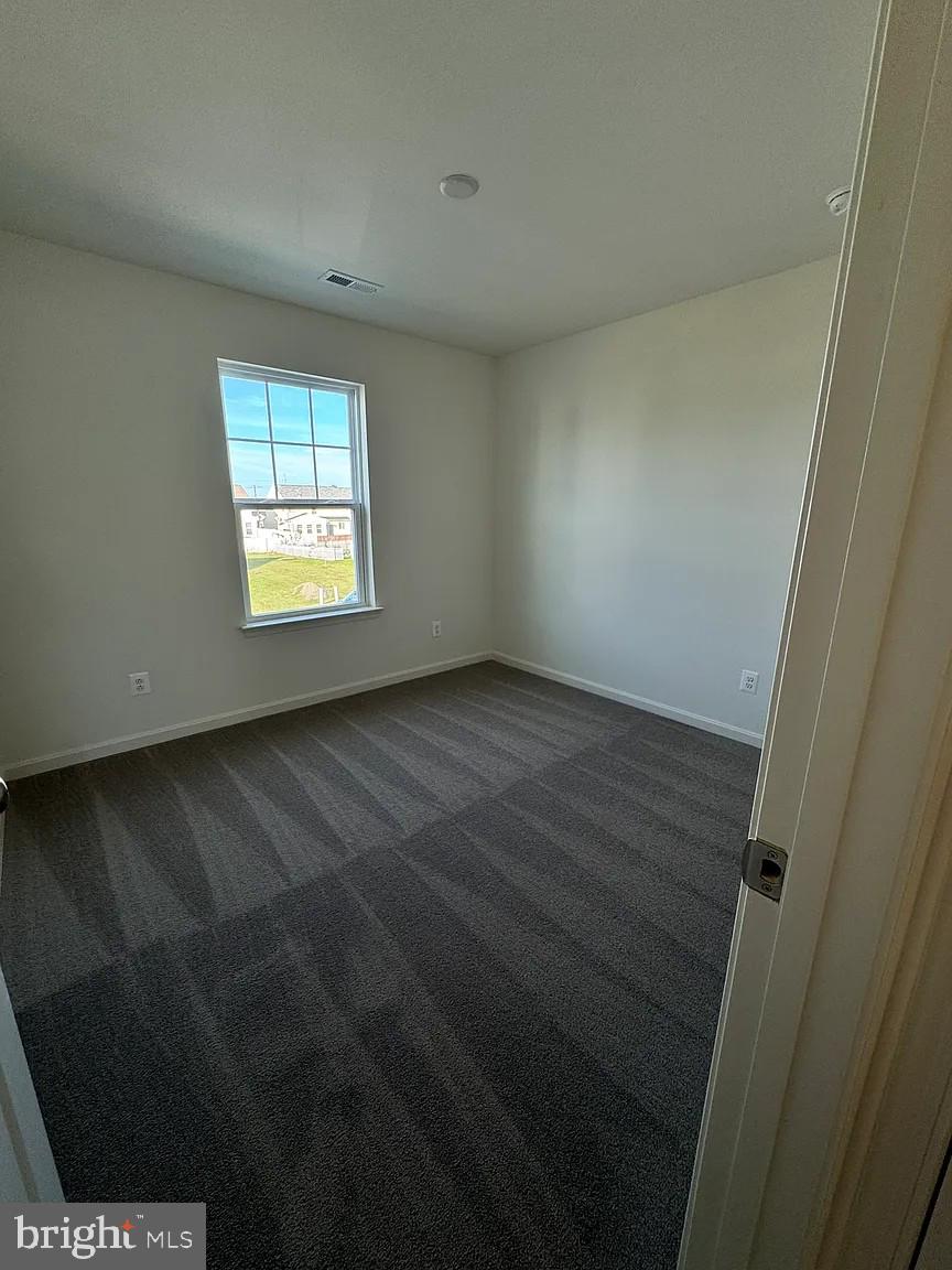 318 Appleby School Road Cambridge, MD 21613 - Photo 7 of 10 a view of an empty room with a window