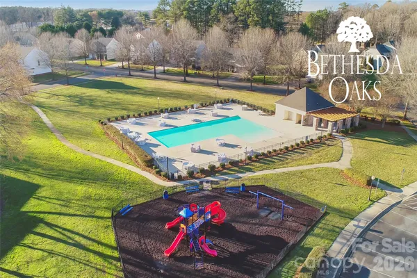 a view of a swimming pool with a yard