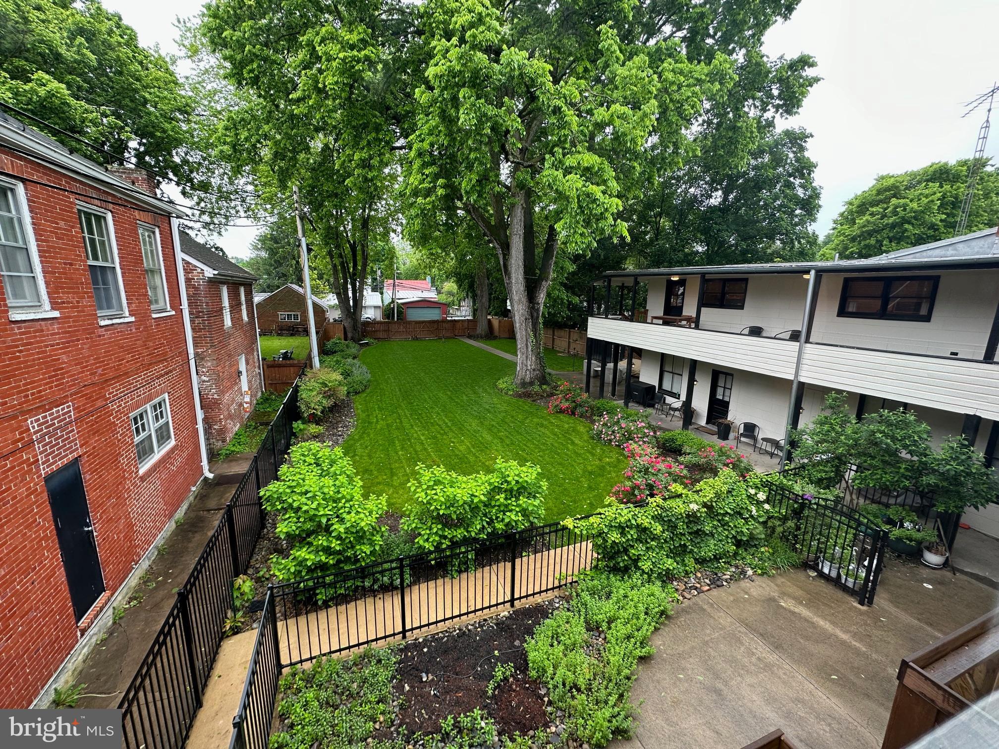 130 East German Street, Unit 201 Shepherdstown, WV 25443 - Photo 18 of 23 a front view of a house with a yard