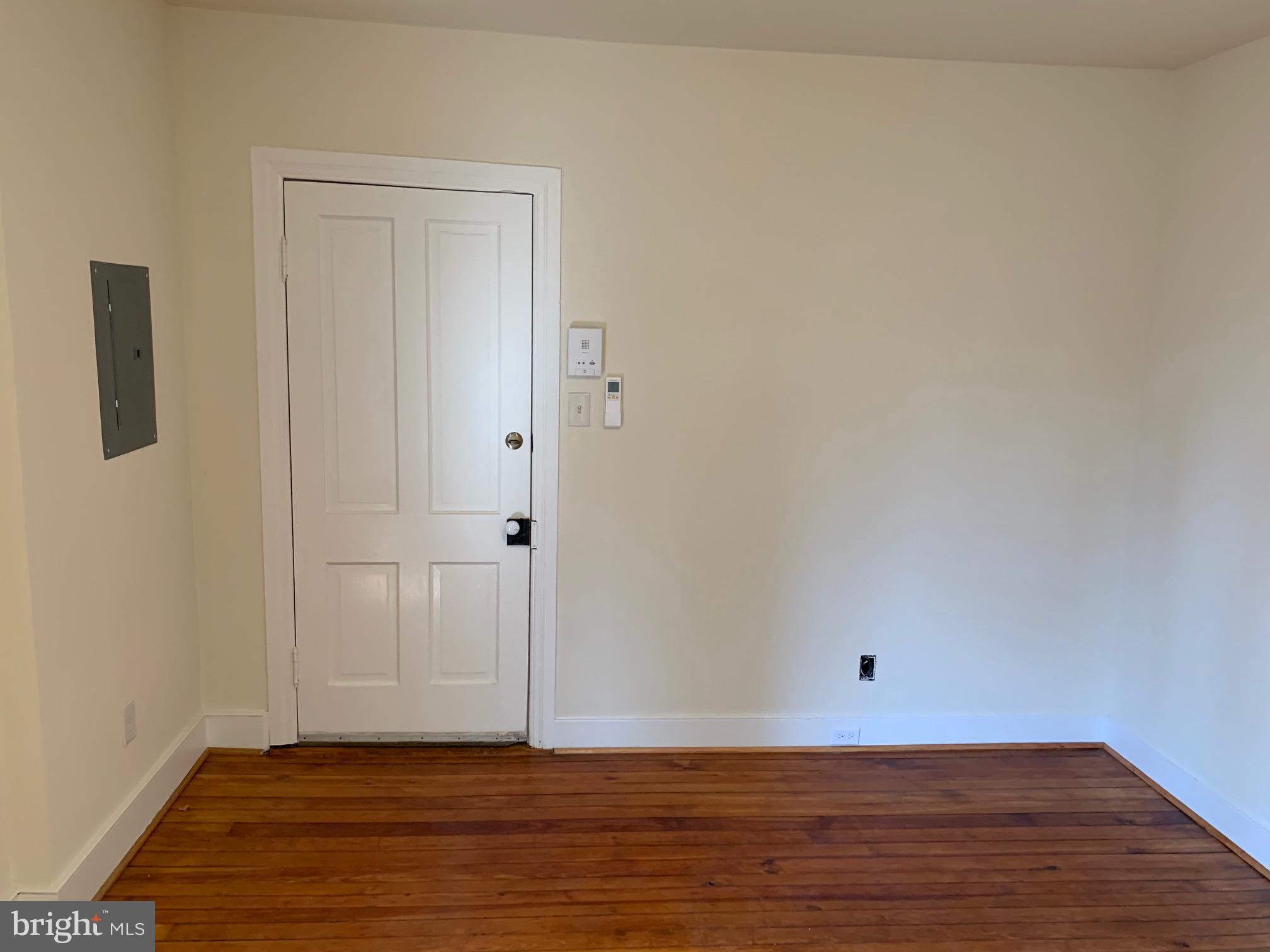 130 East German Street, Unit 201 Shepherdstown, WV 25443 - Photo 7 of 23 a view of an empty room with wooden floor and closet