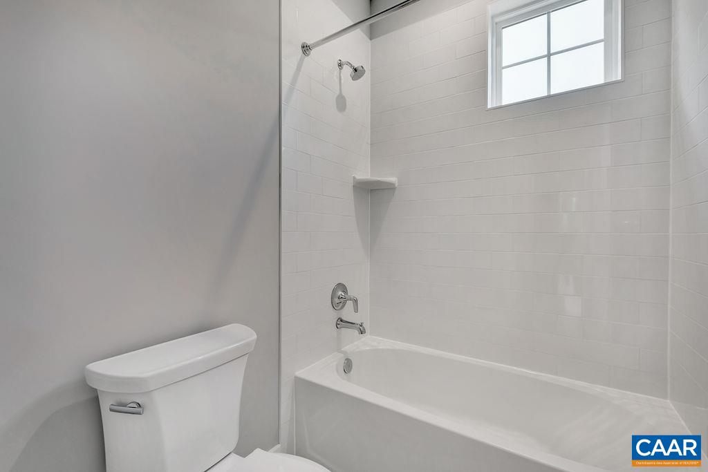 203 Hartmans Mill Road Charlottesville, VA 22902 - Photo 23 of 29 a bathroom with a bathtub and a toilet
