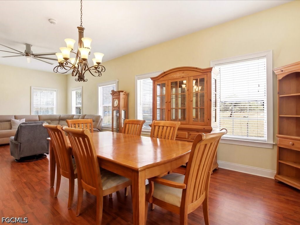 21651 Tuckahoe Road Alva, FL 33920 - Photo 11 of 42 a view of a a dining room with furniture window and wooden floor