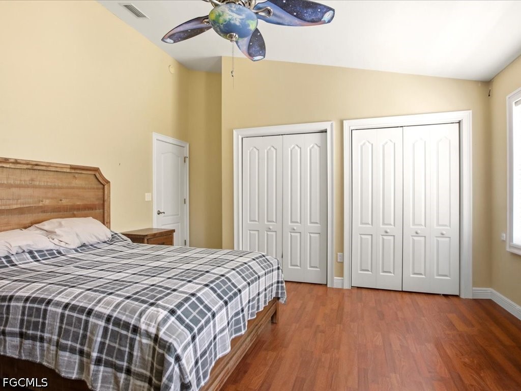 21651 Tuckahoe Road Alva, FL 33920 - Photo 19 of 42 a bedroom with a bed and cabinets