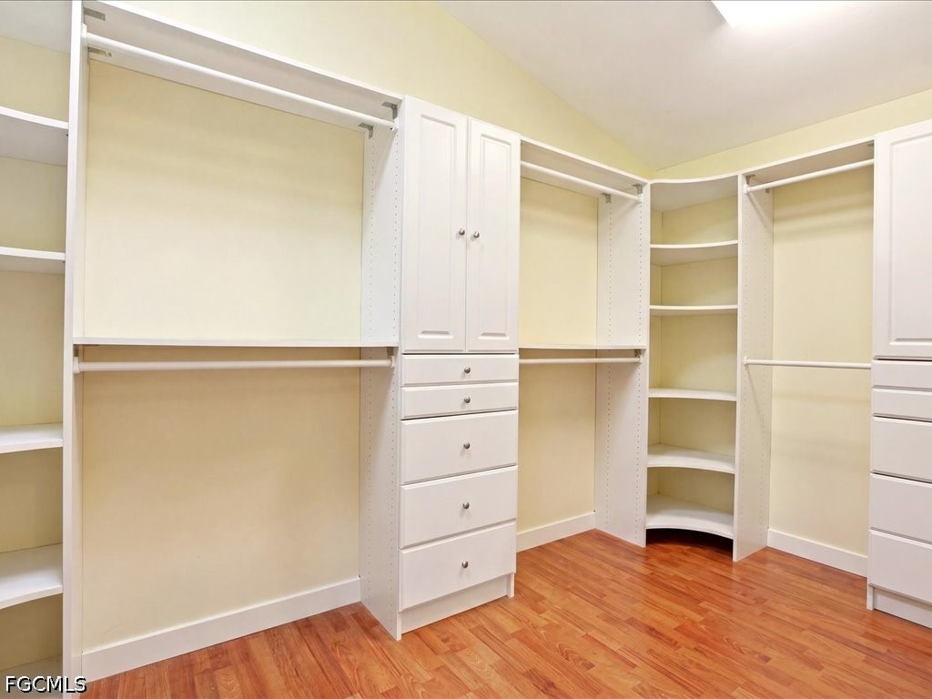 21651 Tuckahoe Road Alva, FL 33920 - Photo 24 of 42 a view of an empty walk in closet with wooden floor