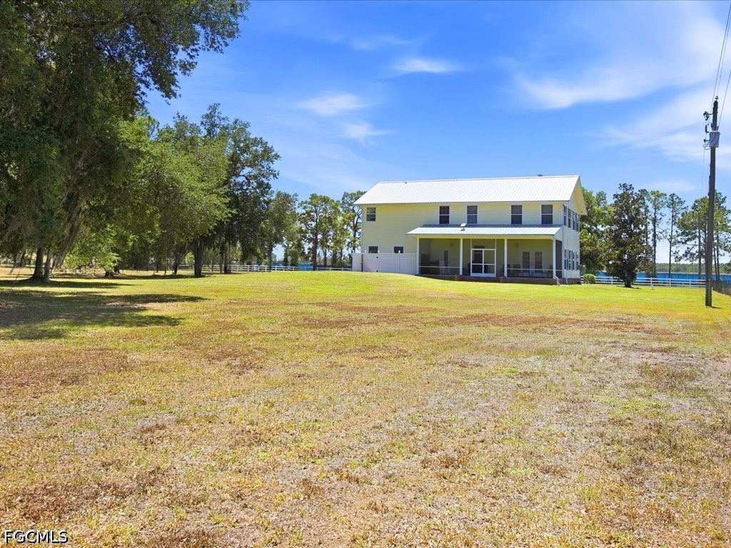 21651 Tuckahoe Road Alva, FL 33920 - Photo 36 of 42 a view of an ocean with a building in the background
