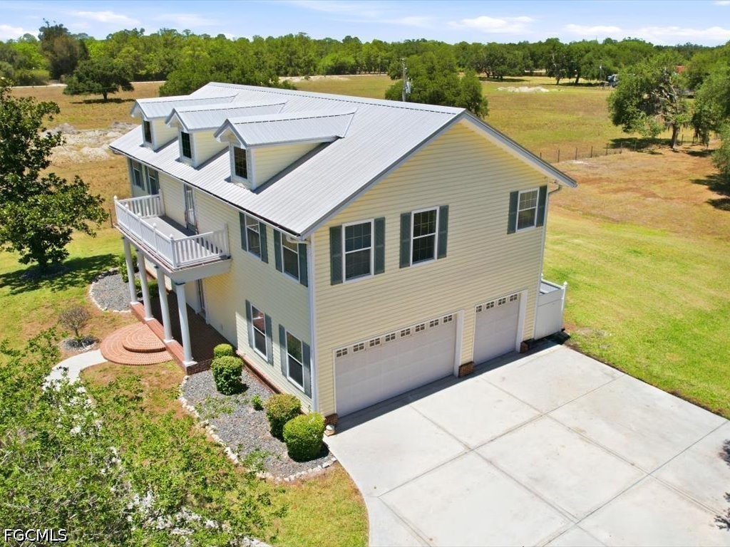 21651 Tuckahoe Road Alva, FL 33920 - Photo 41 of 42 a aerial view of a house with a yard