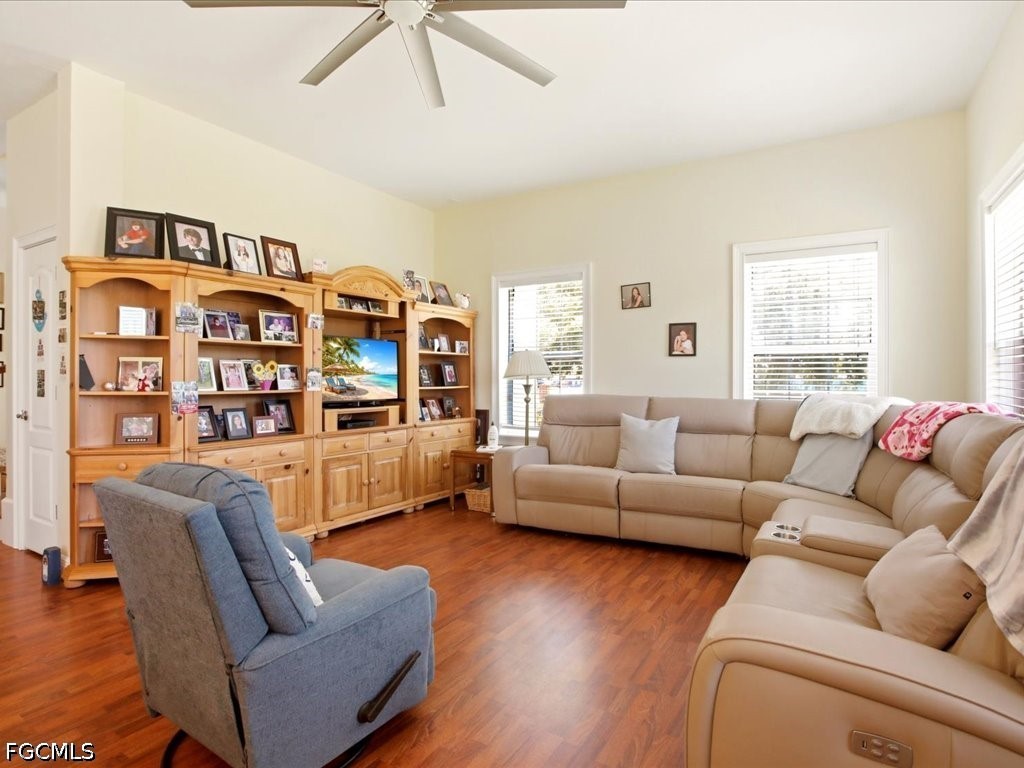 21651 Tuckahoe Road Alva, FL 33920 - Photo 5 of 42 a living room with fireplace furniture and wooden floor