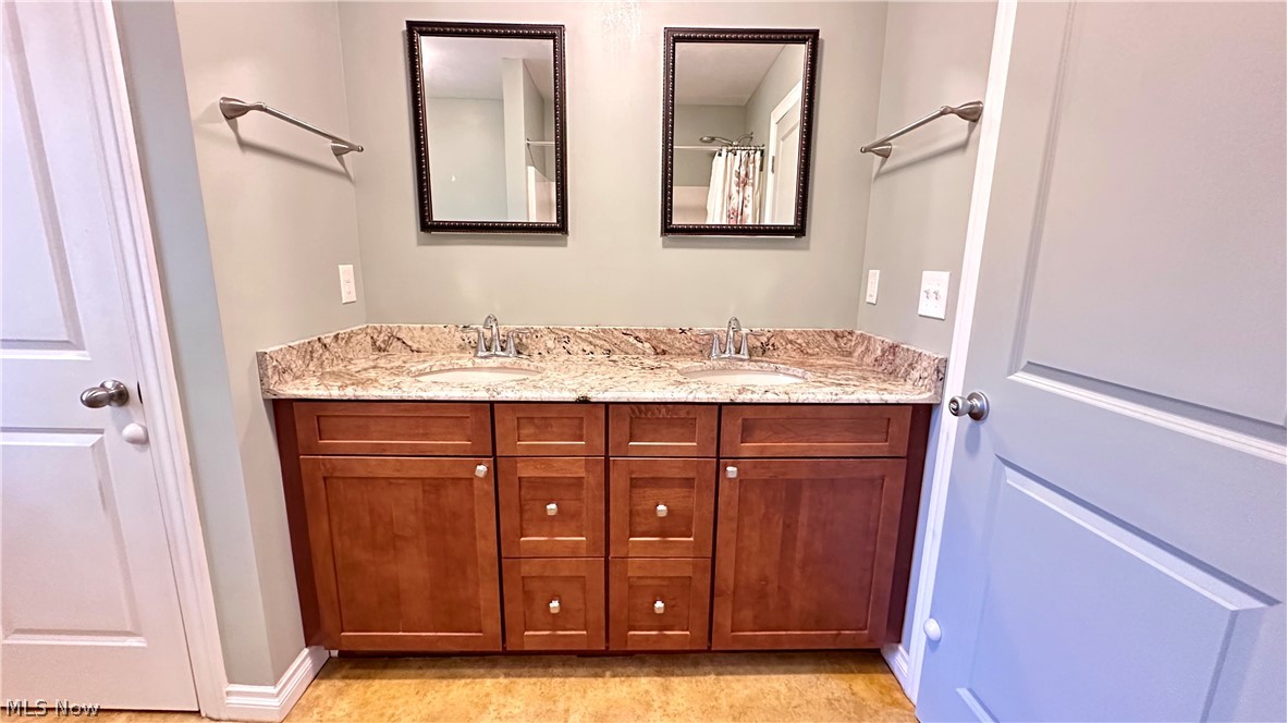 2603 Rockefeller Road Wickliffe, OH 44092 - Photo 22 of 34 Dual vanity with wood-finish cabinetry and a light-colored countertop