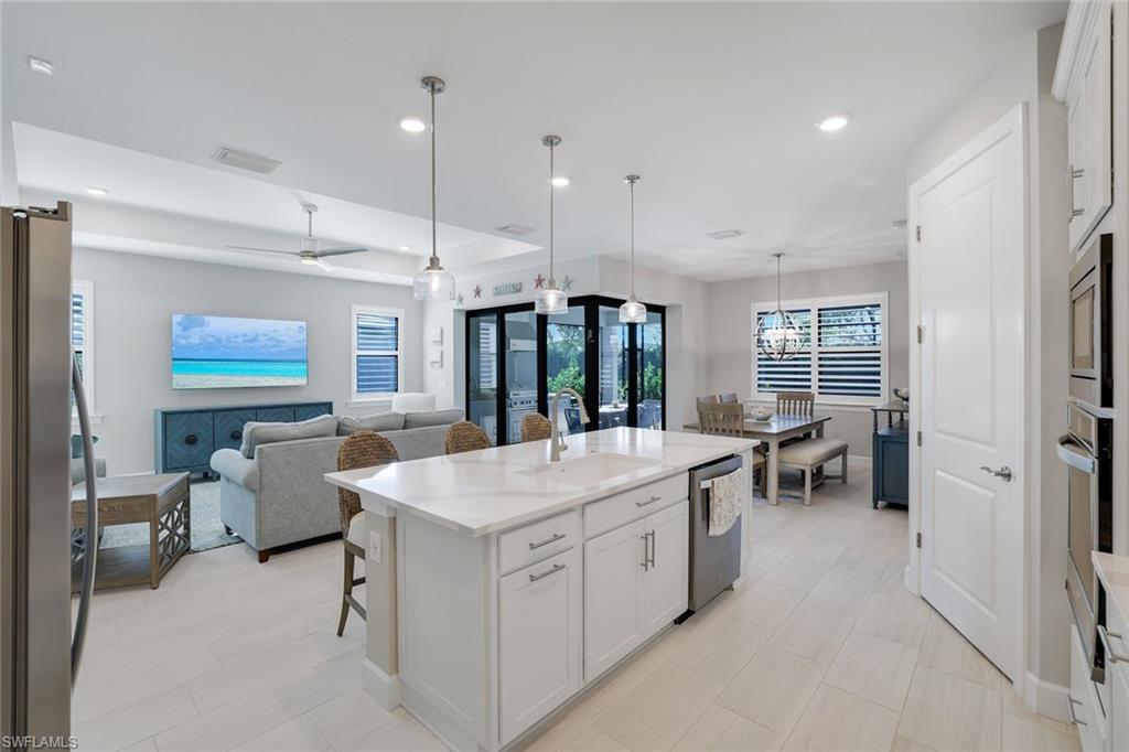 1944 Yellowfin Circle Naples, FL 34114 - Photo 11 of 36 a large white kitchen with a large window