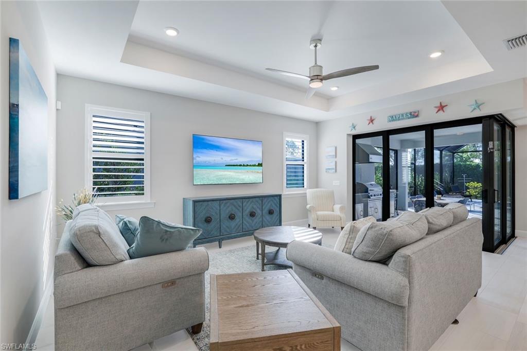 1944 Yellowfin Circle Naples, FL 34114 - Photo 13 of 36 a living room with furniture and a large window