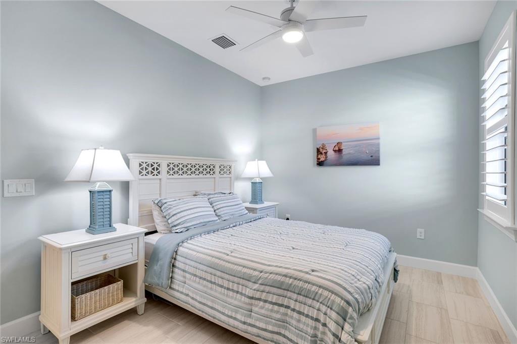 1944 Yellowfin Circle Naples, FL 34114 - Photo 19 of 36 a bedroom with a bed and a window
