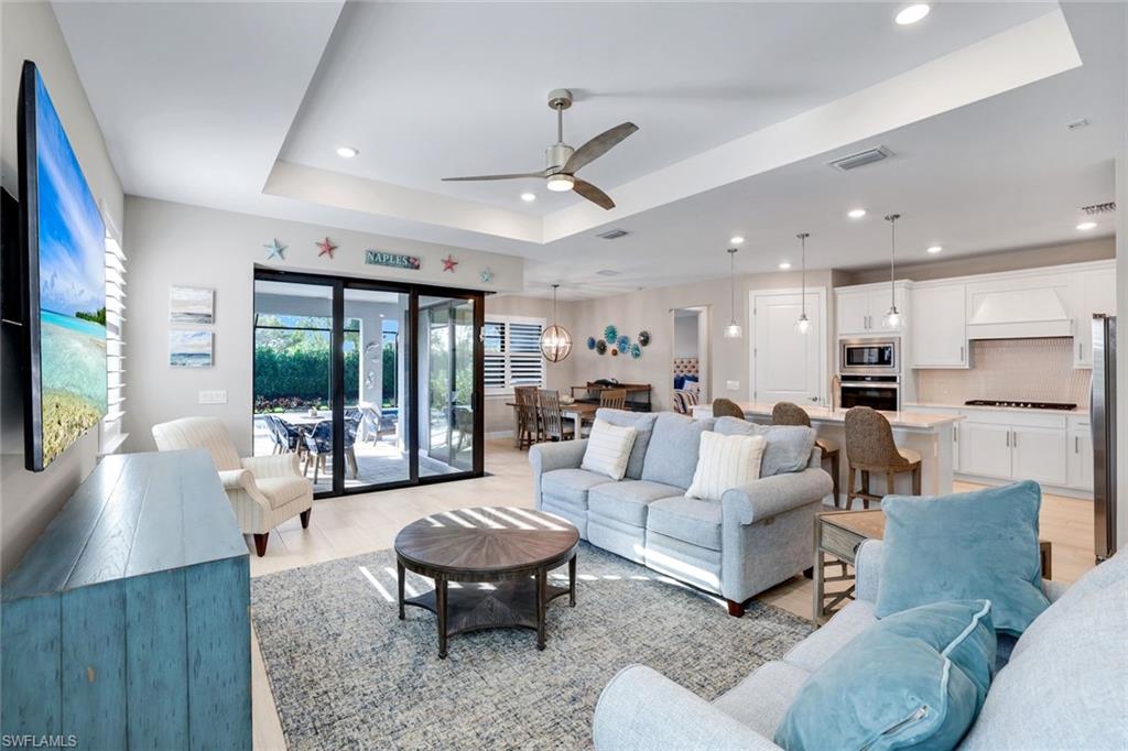1944 Yellowfin Circle Naples, FL 34114 - Photo 2 of 36 a living room with furniture and a large window