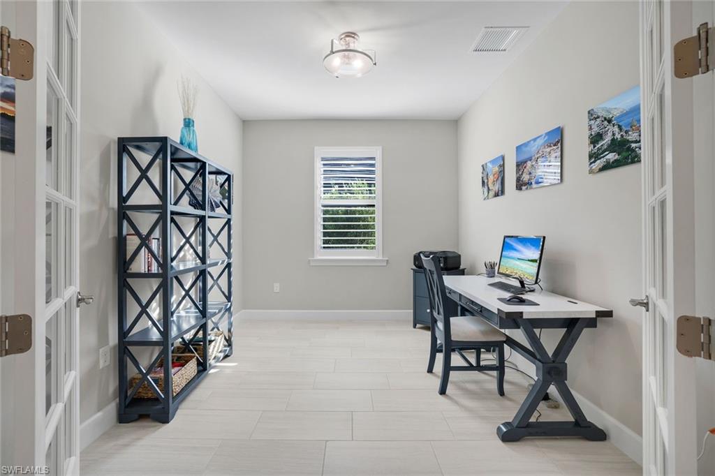 1944 Yellowfin Circle Naples, FL 34114 - Photo 21 of 36 a workspace with furniture and a window