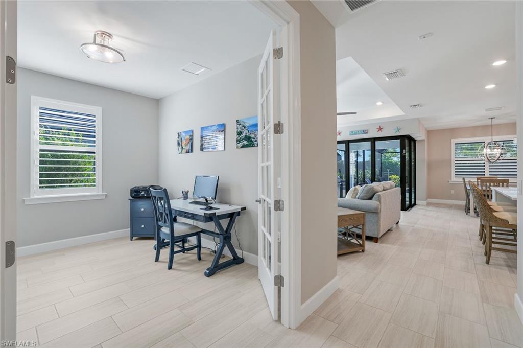 1944 Yellowfin Circle Naples, FL 34114 - Photo 22 of 36 a workspace with furniture and a window