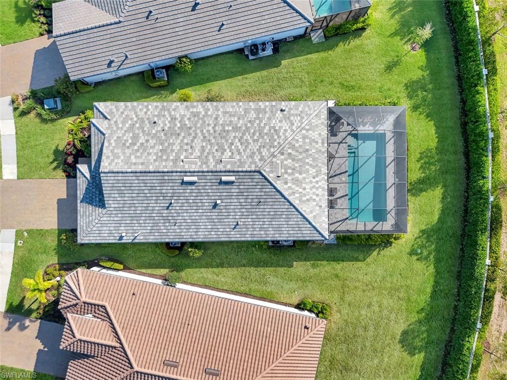 1944 Yellowfin Circle Naples, FL 34114 - Photo 27 of 36 an aerial view of a house with a garden