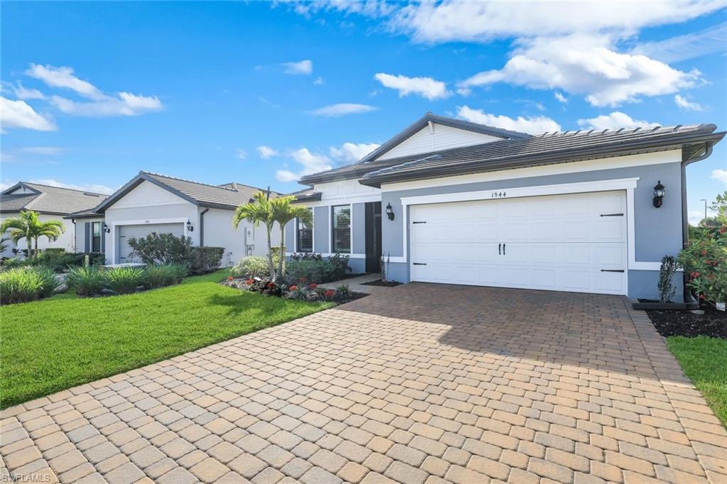 1944 Yellowfin Circle Naples, FL 34114 - Photo 31 of 36 a view of a house with a yard