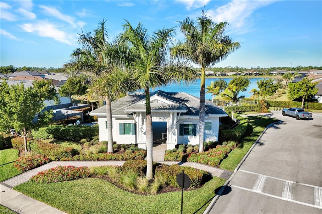 1944 Yellowfin Circle Naples, FL 34114 - Photo 36 of 36 a view of a house with backyard porch and sitting area