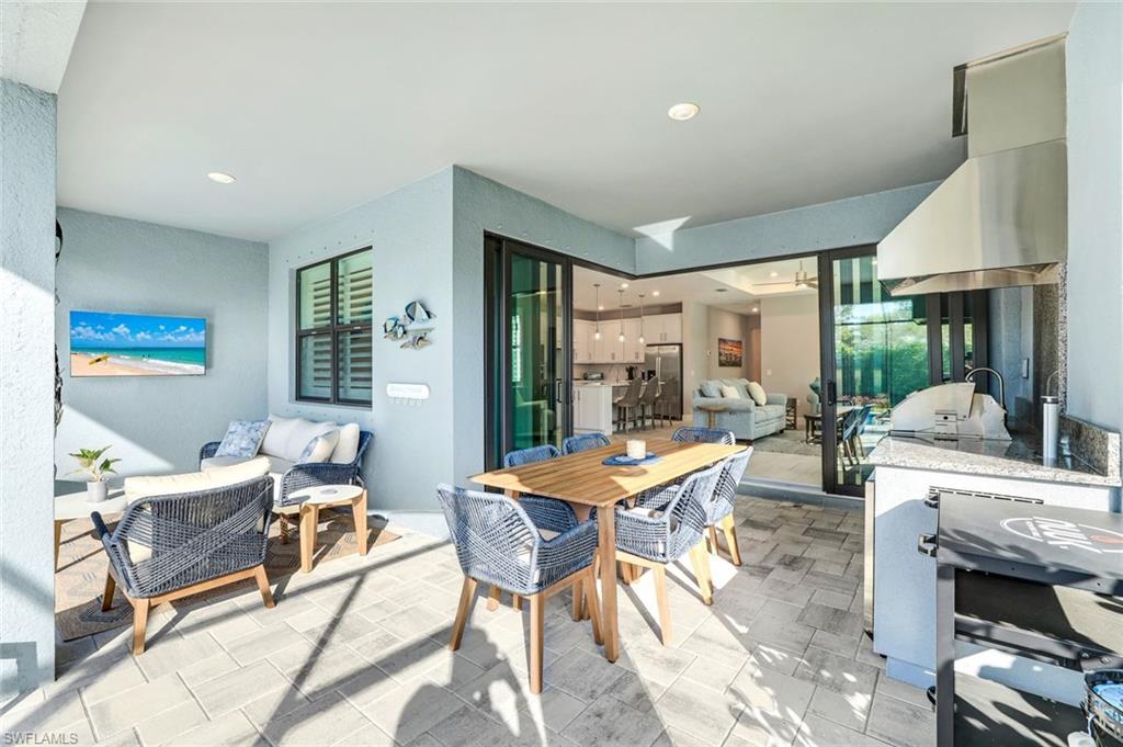1944 Yellowfin Circle Naples, FL 34114 - Photo 7 of 36 a view of a dining room with furniture window and outside view