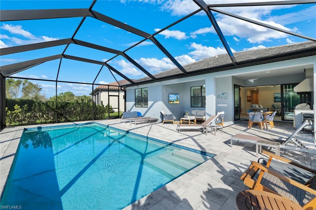 1944 Yellowfin Circle Naples, FL 34114 - Photo 9 of 36 a view of swimming pool with outdoor seating