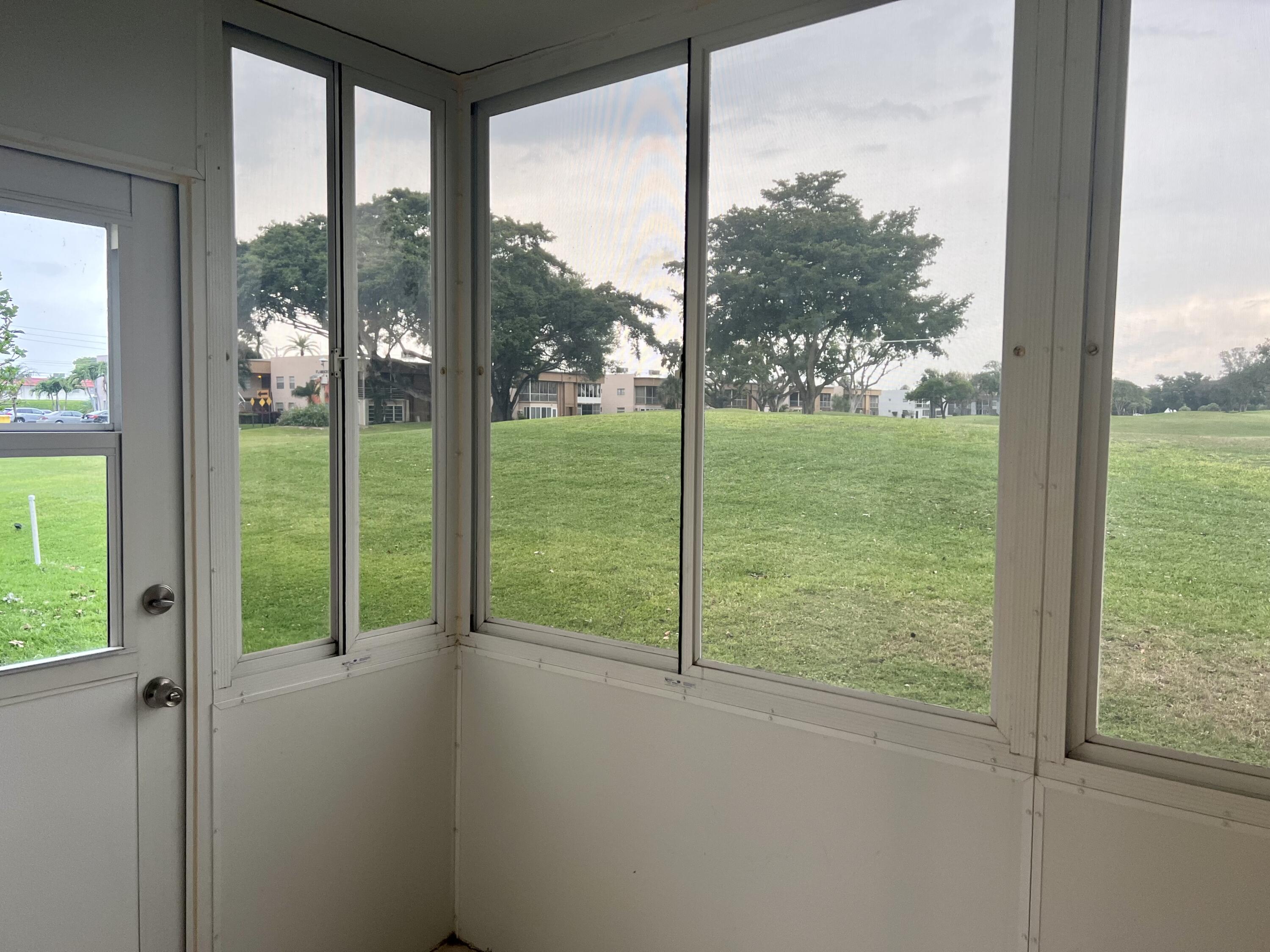 592 Flanders North Delray Beach, FL 33484 - Photo 24 of 33 screened in porch -golf views