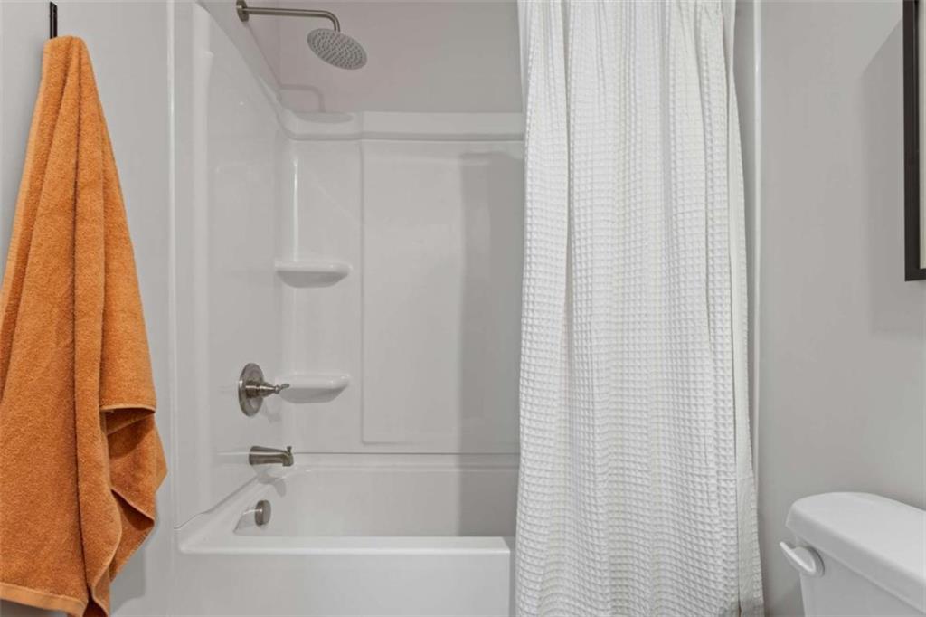 211 Ivey Terrace Temple, GA 30179 - Photo 14 of 26 a bathroom with a shower curtain and a curtain