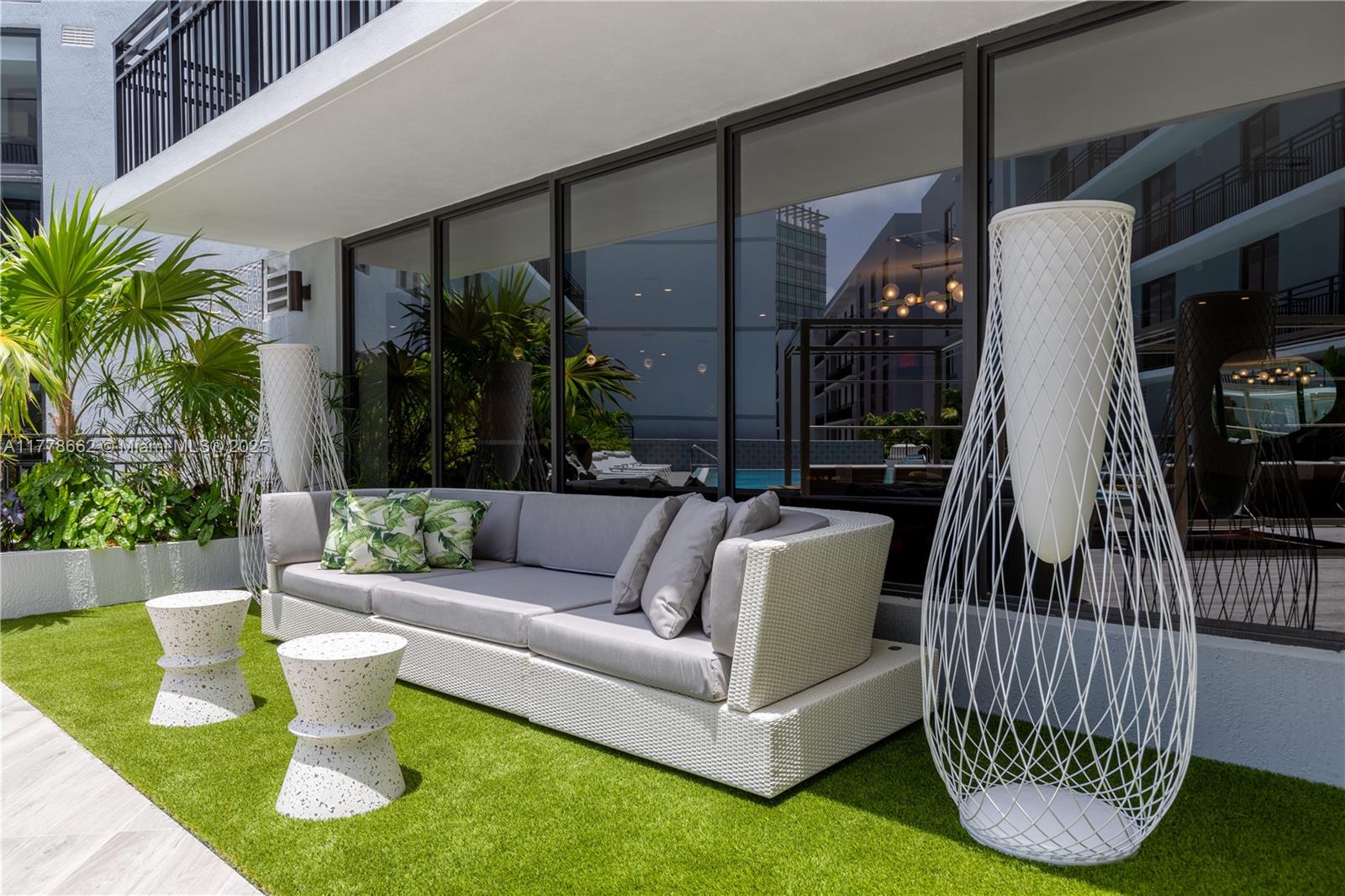 1005 Spring Garden Road, Unit PH801 Miami, FL 33136 - Photo 12 of 38 a view of swimming pool with a couches chairs and a yard