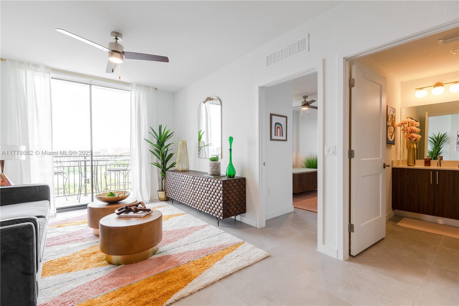 1005 Spring Garden Road, Unit PH801 Miami, FL 33136 - Photo 9 of 38 a living room with furniture and a potted plant