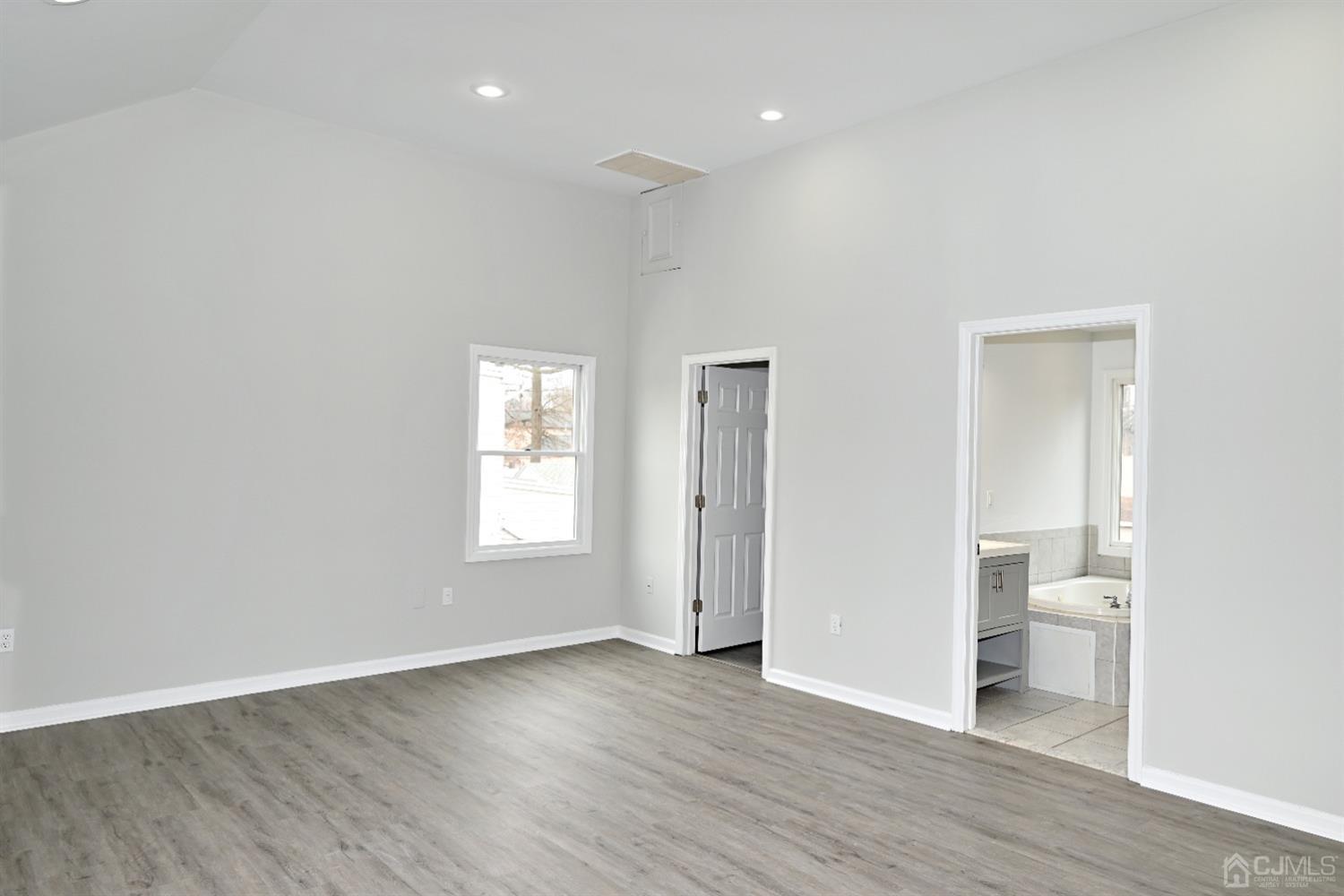 53 Sturgis Road Edison, NJ 08817 - Photo 8 of 22 a view of a room with wooden floor and window