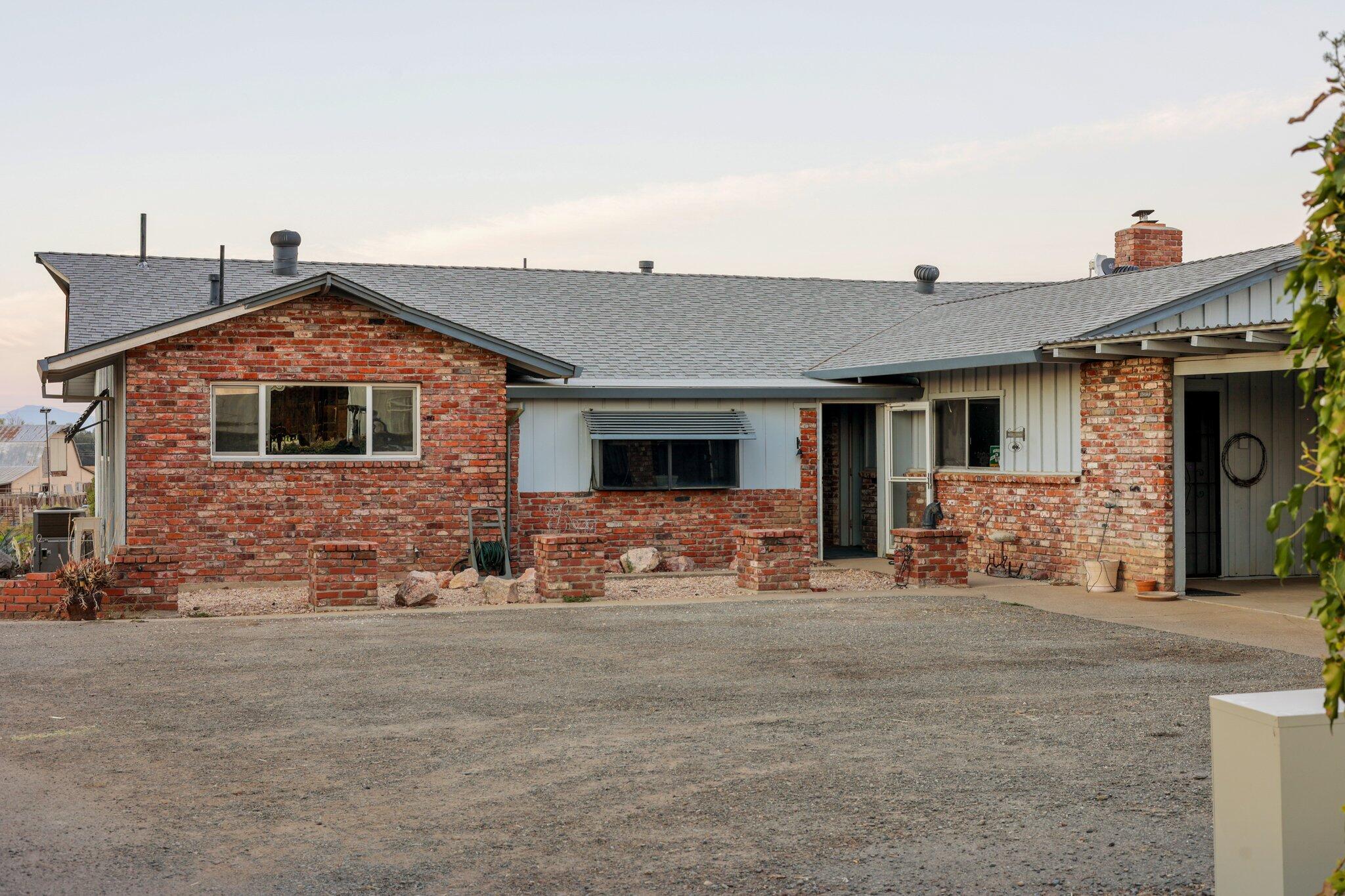 5078 Balls Ferry Road Anderson, CA 96007 - Photo 113 of 113 a front view of a house with a yard