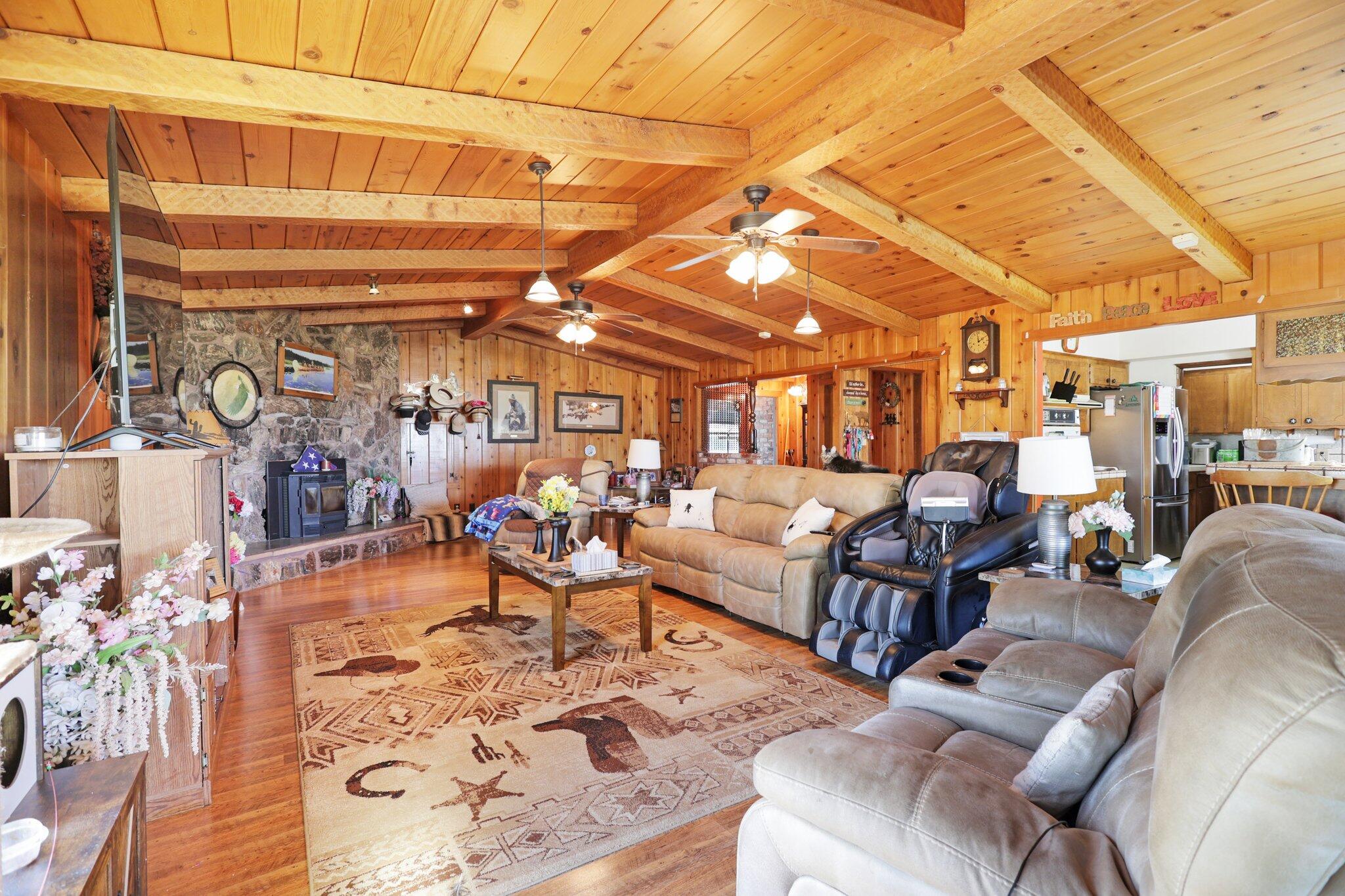 5078 Balls Ferry Road Anderson, CA 96007 - Photo 12 of 113 a living room with lots of furniture and a painting on the wall