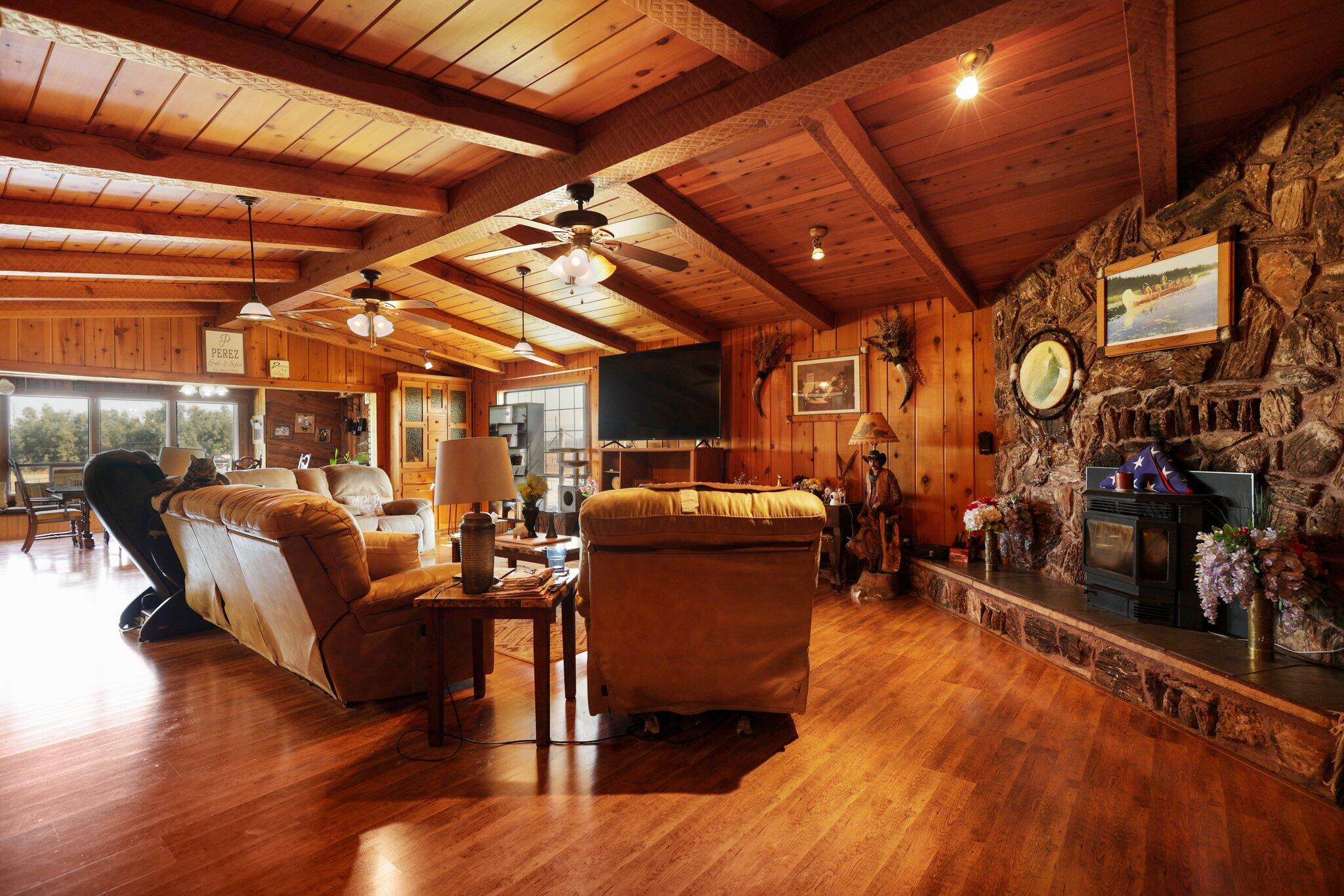 5078 Balls Ferry Road Anderson, CA 96007 - Photo 13 of 113 a living room with lots of furniture and wooden floors
