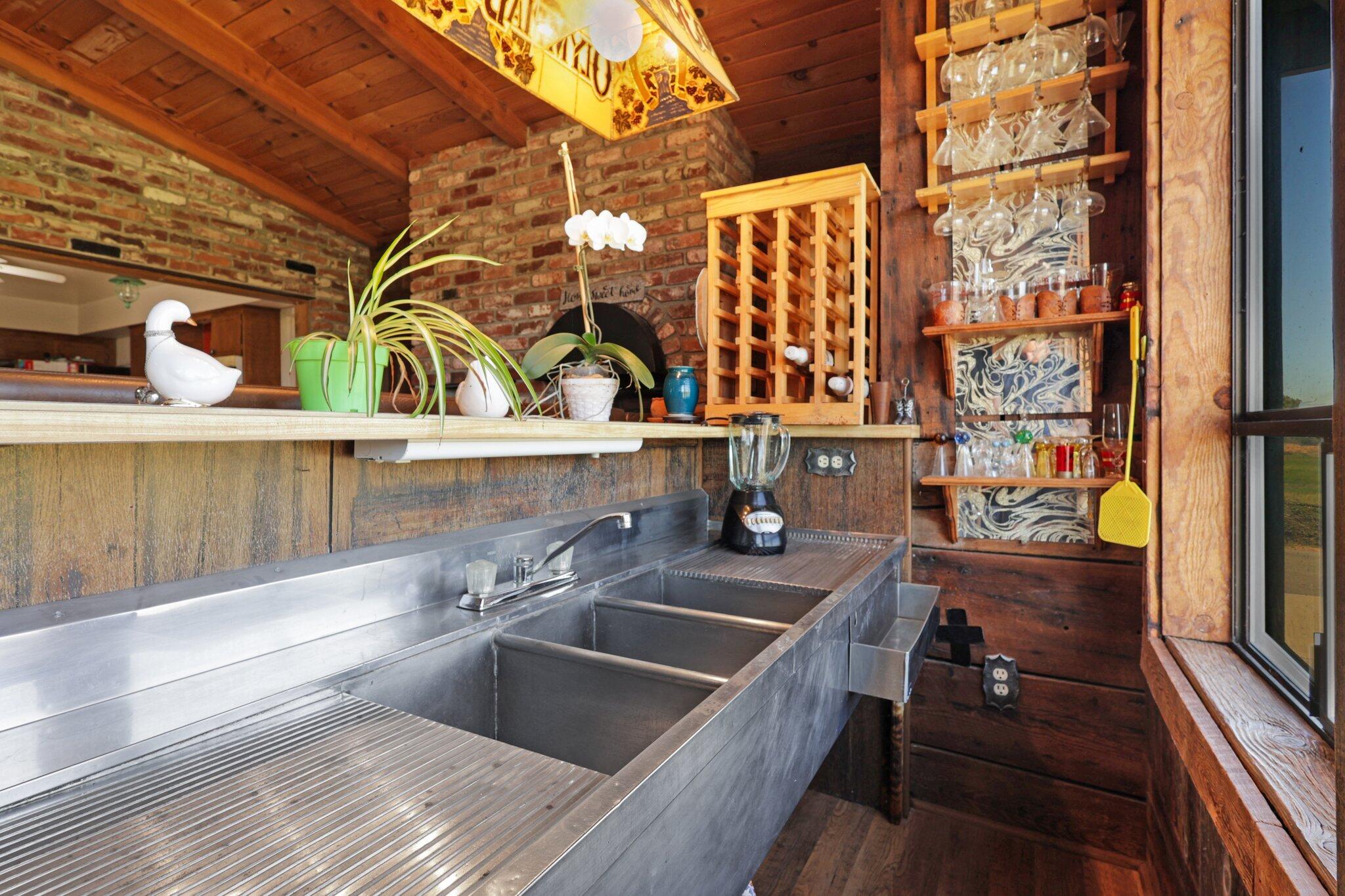 5078 Balls Ferry Road Anderson, CA 96007 - Photo 18 of 113 a kitchen with a sink and a refrigerator