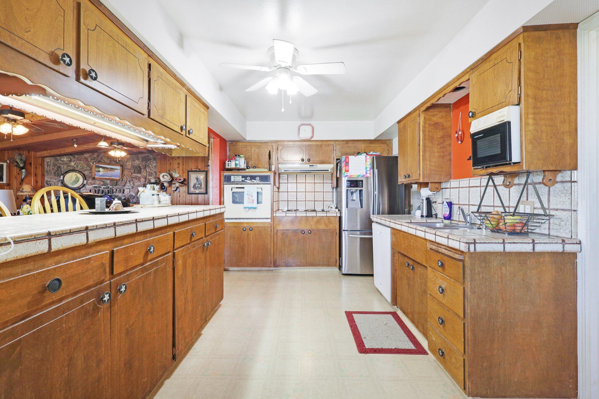 5078 Balls Ferry Road Anderson, CA 96007 - Photo 20 of 113 a kitchen with stainless steel appliances granite countertop a sink and cabinets