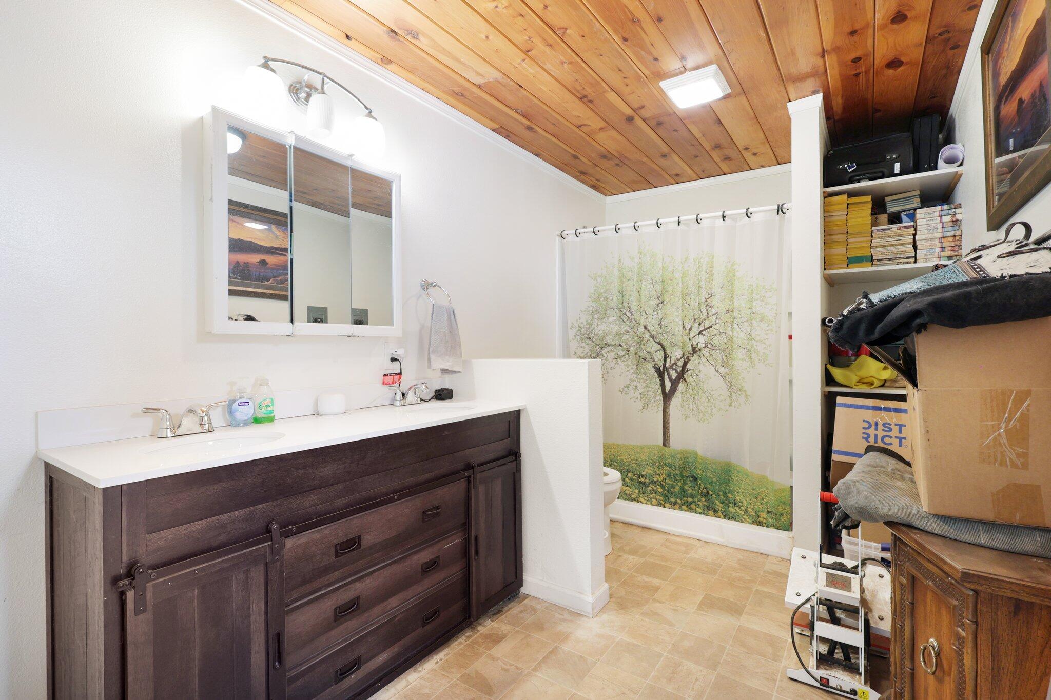 5078 Balls Ferry Road Anderson, CA 96007 - Photo 28 of 113 a bathroom with a double vanity sink mirror and shower