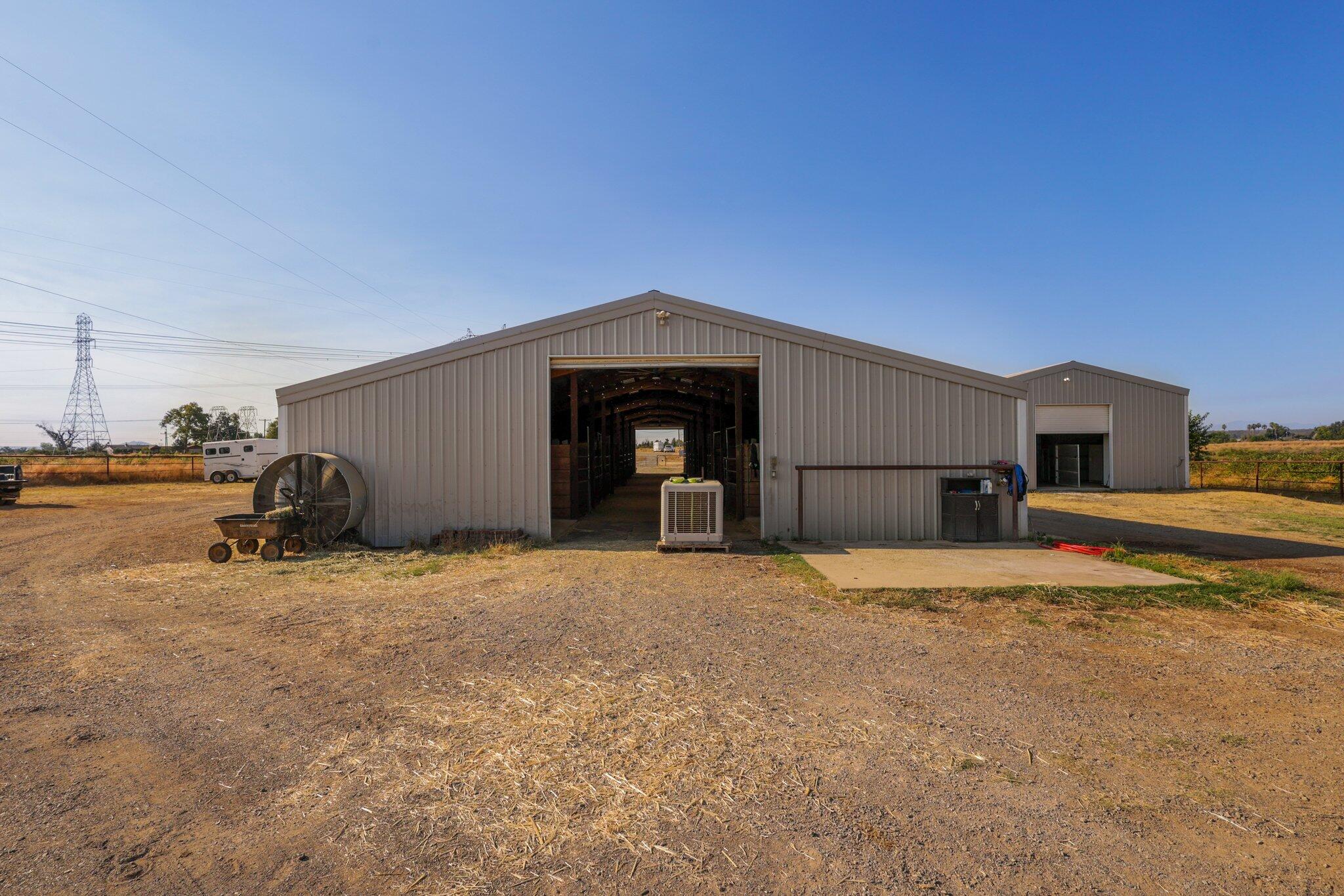 5078 Balls Ferry Road Anderson, CA 96007 - Photo 56 of 113 a front view of a house with a yard and garage