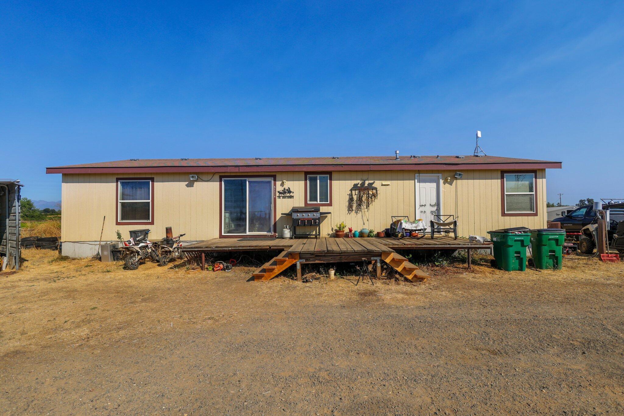 5078 Balls Ferry Road Anderson, CA 96007 - Photo 63 of 113 a view of swimming pool with outdoor seating and house in the background