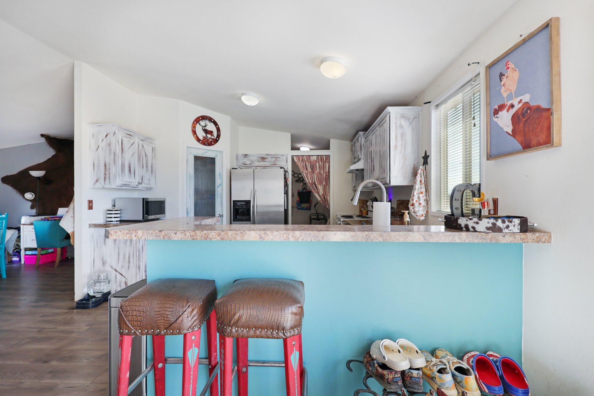 5078 Balls Ferry Road Anderson, CA 96007 - Photo 79 of 113 a kitchen with furniture a clock and a view of living room