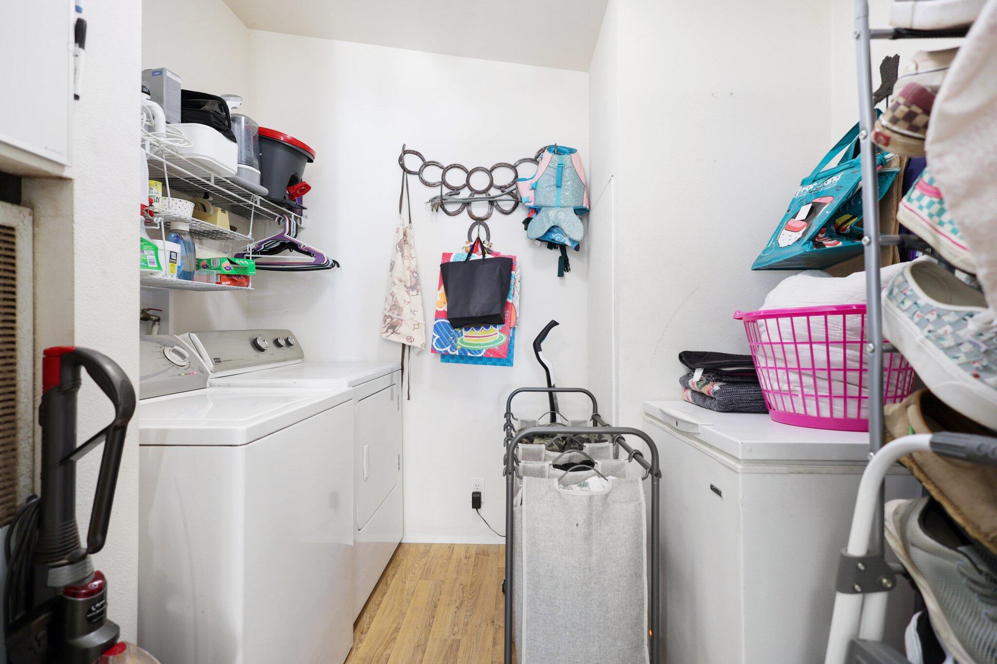 5078 Balls Ferry Road Anderson, CA 96007 - Photo 80 of 113 a view of walk in closet with clothes and shoes